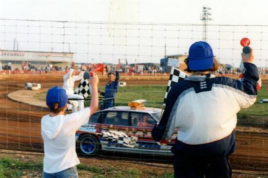 Ali and Christopher blow a whole airhorn charge after the tremendous excitement of a 307 Tim Warwick Heat One win at Skeggy's 16th August meeting in 1997.
