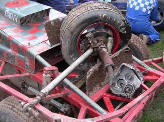 The bits that the fence ripped off
Outside rear wheel, half shaft, broken axle, and what's left of the gearbox.

