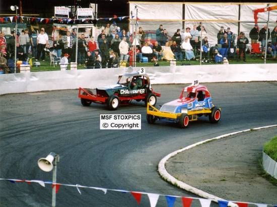 3 & 391 on parade lap in cars of the 70,s
