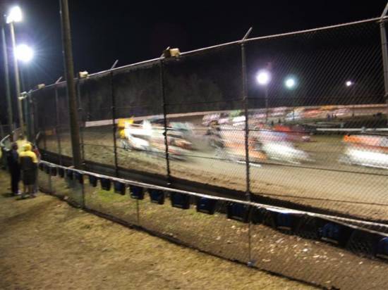 up close to the fence at Volusia, if you squint you'll see the Winged Sprints 4 abreast rolling lap.
