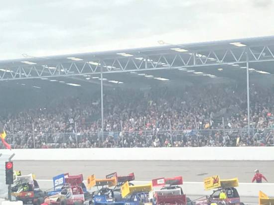 The large crowd in the huge main grandstand
