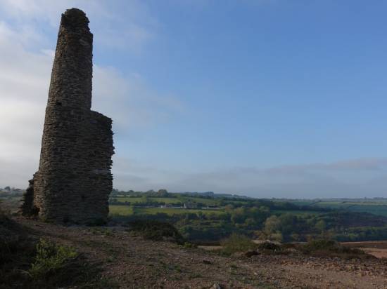 Pumping engine house and chimneys dot the landscape 
