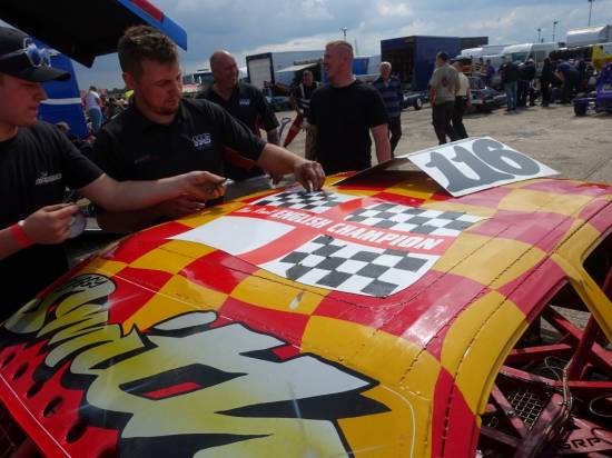 The 116 team stick the individual checkers onto the English champ roof panel
