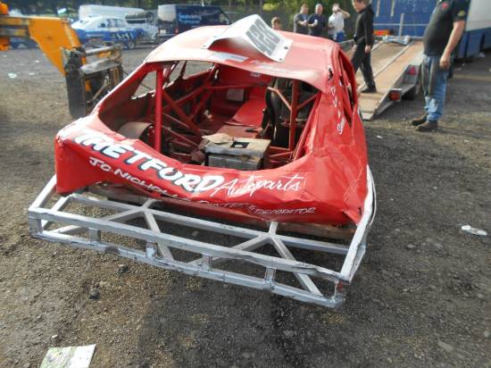 Lee Sampson - The winning car of the Raymond Gunn Tribute shows the damage from the last bend hit inflicted by 670.
