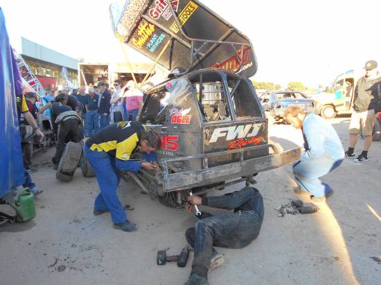 Work on-going on NZ282. Plenty of mechanics needed today for Team Wainman. Phil's lads from NZ were working on his car  
