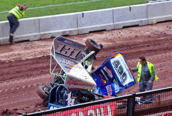 Graeme throws a few shapes for the main stand crowd after a rollover in the V8's
