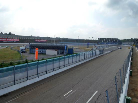 The banked half mile outer oval with the flat inner oval between the two stands
