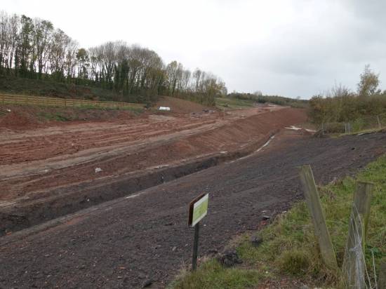 The new road has used part of the trackbed. The tunnel is off to the right.
