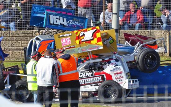A spectacular crash to end the weekend sees 164 on top of the fence and the 1 car. 524 can just be seen on Tom's front bumper.
