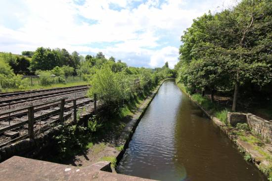 The Huddersfield to Manchester line runs alongside the canal
