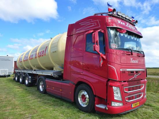 This cherry red Volvo FH water tanker supplied the on track equipment
