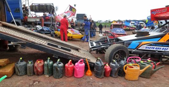 A colourful line up of watering cans at the 16 pit
