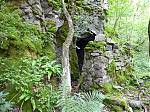 26_The_well_hidden_rock-cut_shelter_with_its_blast_wall_at_the_front.JPG