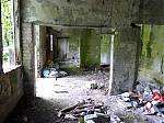 2_The_crumbling_interior_showing_the_open_corridor_which_ran_the_full_length_of_the_rear.JPG
