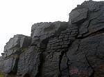33_A_partial_drystone_wall_halfway_up_the_back_wall_of_the_quarry.jpg