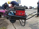 3_Paul_Moss_-_An_engine_change_after_practice__The_untested_replacement_arrives_from_Team_Gilbert.JPG