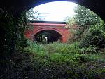 8_Facing_towards_the_A149_overbridge_from_within_the_tunnel2C_and_the_trackbed_to_Roughton_Road_Junction.jpg
