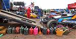 A_colourful_line_up_of_watering_cans_at_the_16_pit.JPG