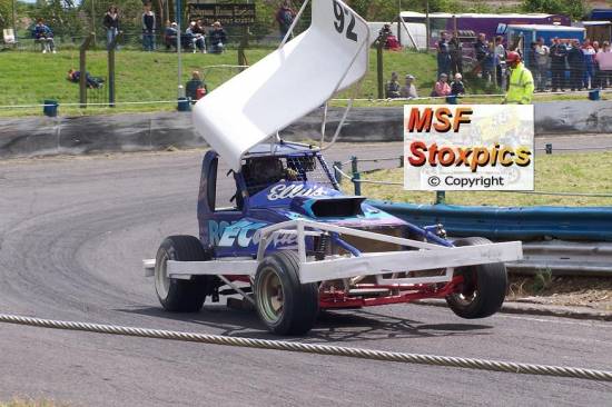 92 Simon Brooke lifts a wheel coming out of turn 4

