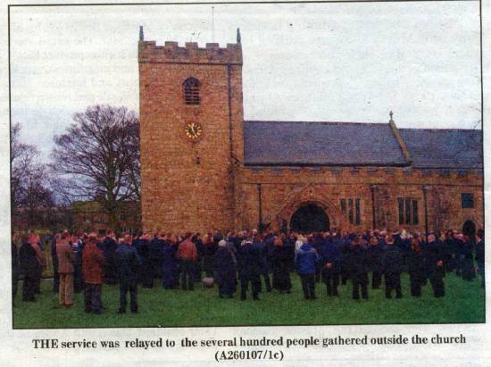 Sam Lund funeral
Mourners gather outside the church
