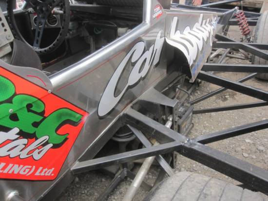 84, bent chassis following the turn three impact
