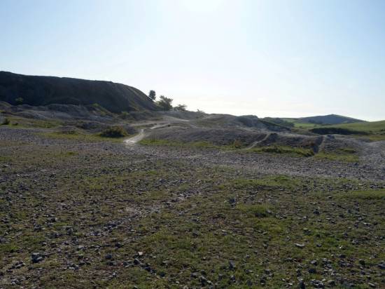 Around and about are spoil heaps and bare ground
